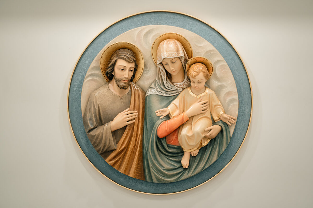 Holy Family relief medallion on the sanctuary wall
