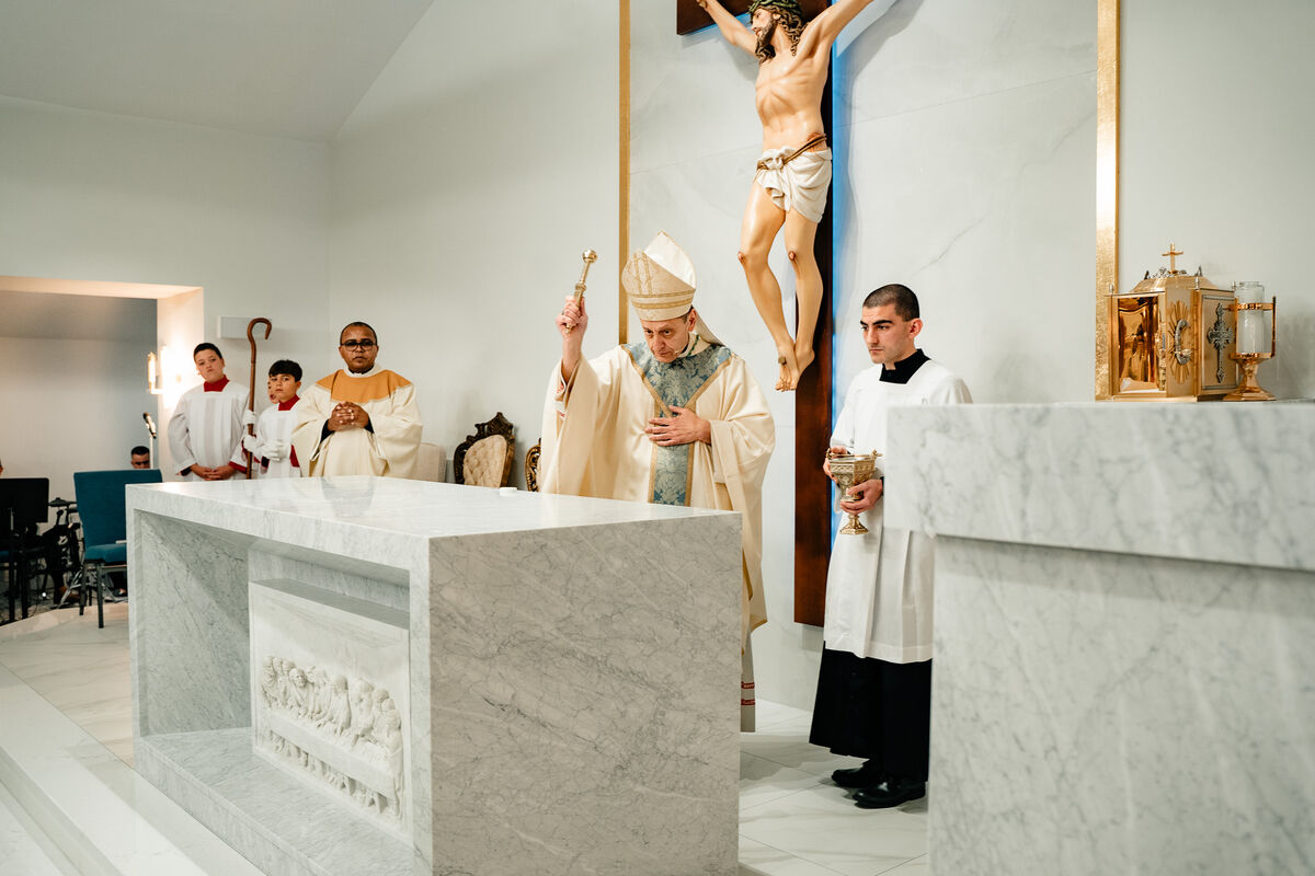 Bishop with altar servers during the consecration