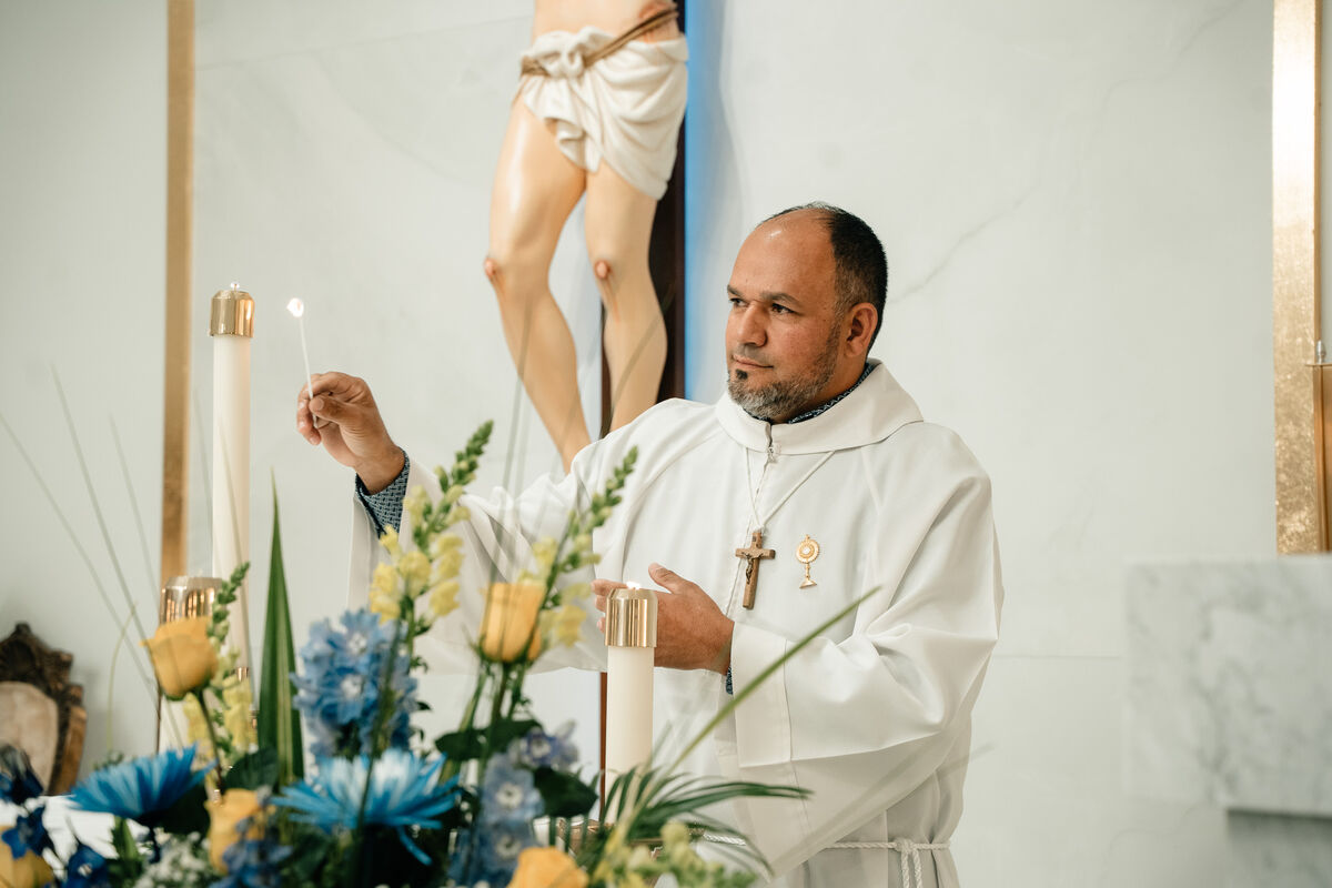 Priest lights the Paschal candle