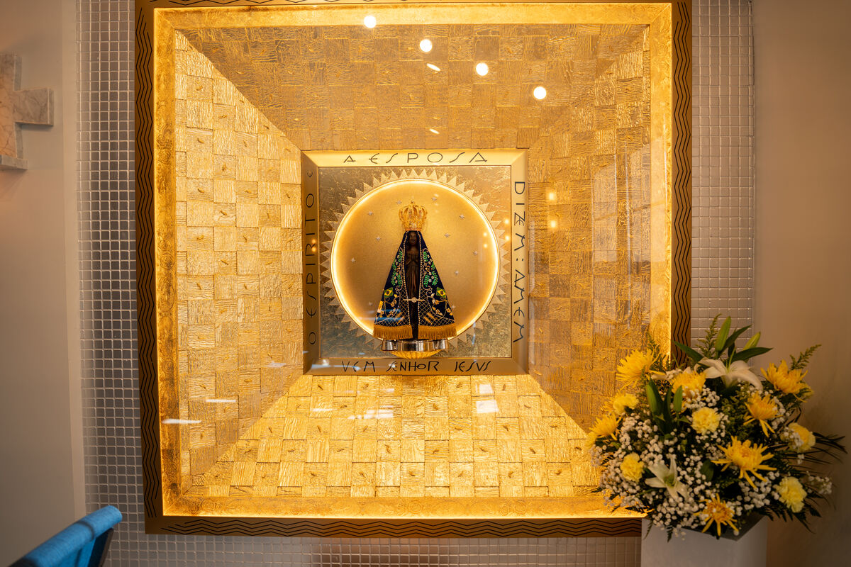 The illuminated shrine niche of Nossa Senhora Aparecida at Our Lady of Aparecida in Bethel