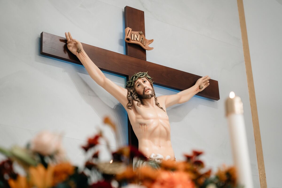 Crucifix with INRI plaque above the altar