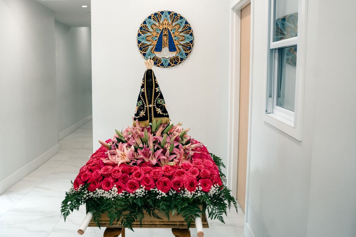 Statue of Our Lady atop a rose arrangement for the May Crowning