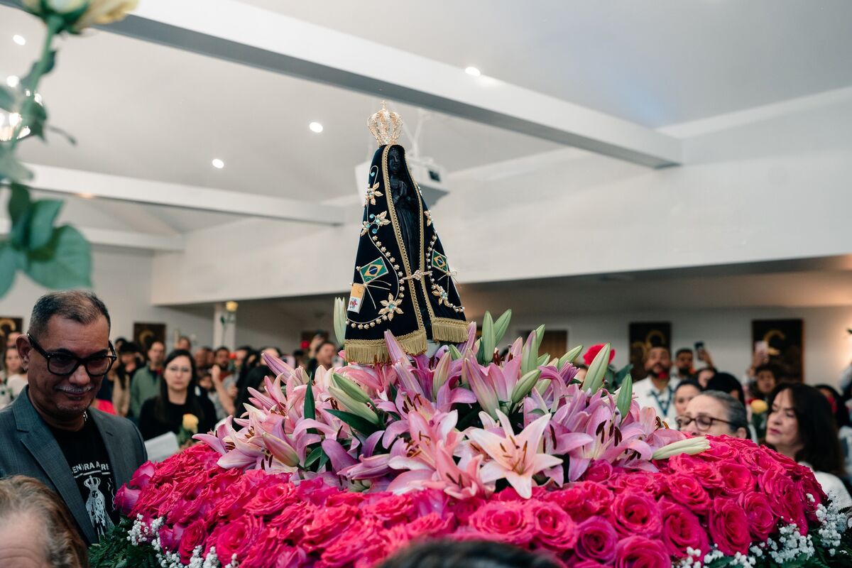 Statue of Our Lady of Aparecida on the rose-covered processional float