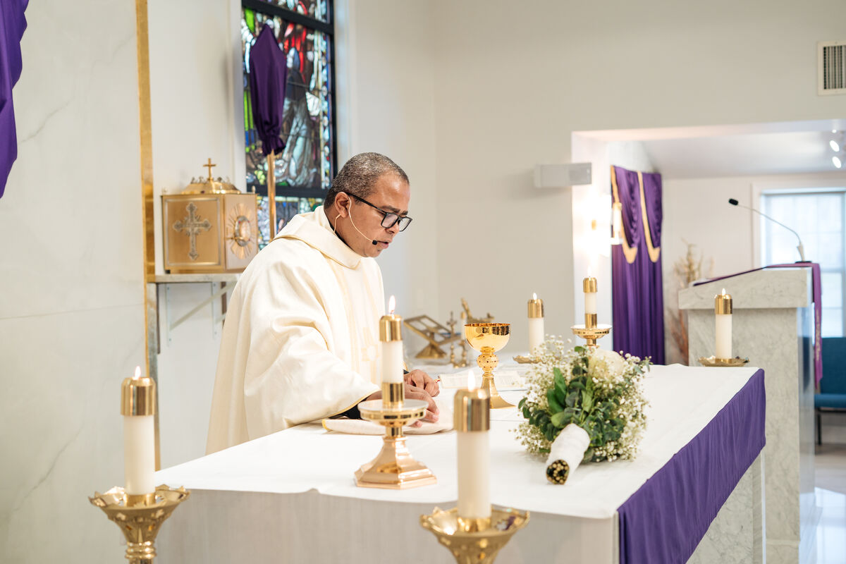 Lenten Mass - priest at the altar with purple drapery